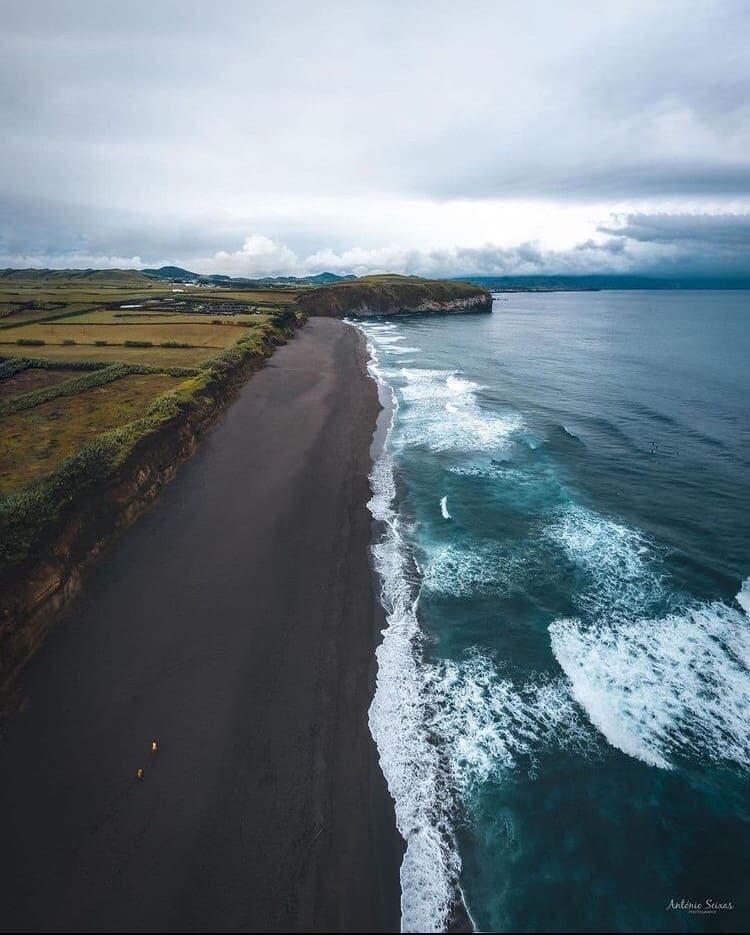 Black sand meets the ocean at Praia de Santa Barbara - The 15 Best Beaches in Azores, Portugal